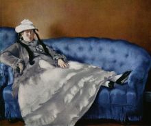 Portrait of the woman on a blue sofa