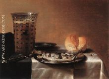 Still life with a glass of beer and smoked herring on a plate